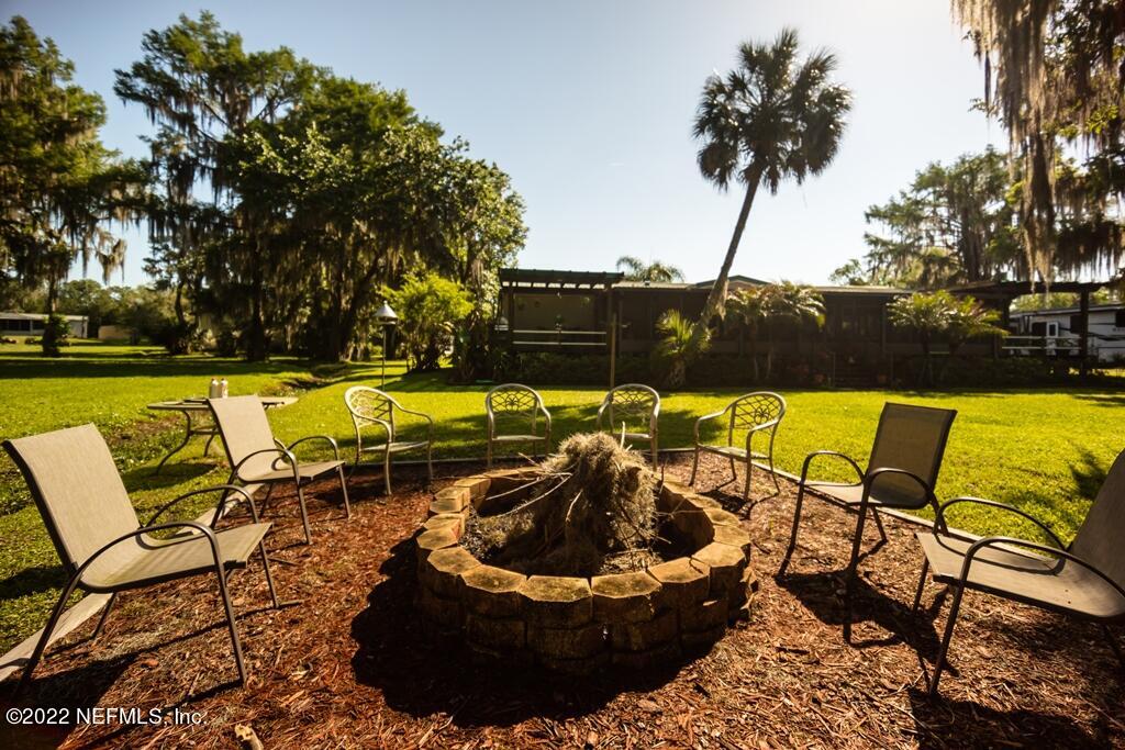105 South Lake George Drive Georgetown, FL 32139 - Photo 59 of 71 a view of a swimming pool and lounge chair