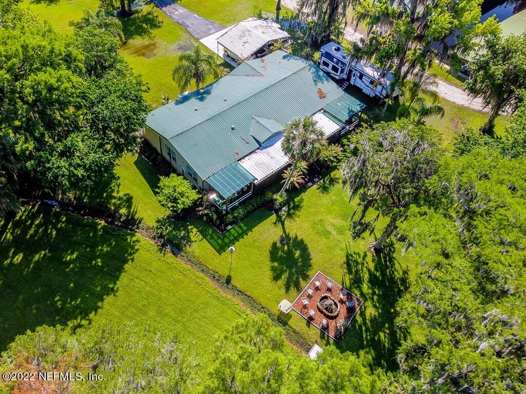 105 South Lake George Drive Georgetown, FL 32139 - Photo 66 of 71 an aerial view of a house with a yard swimming pool outdoor seating and yard
