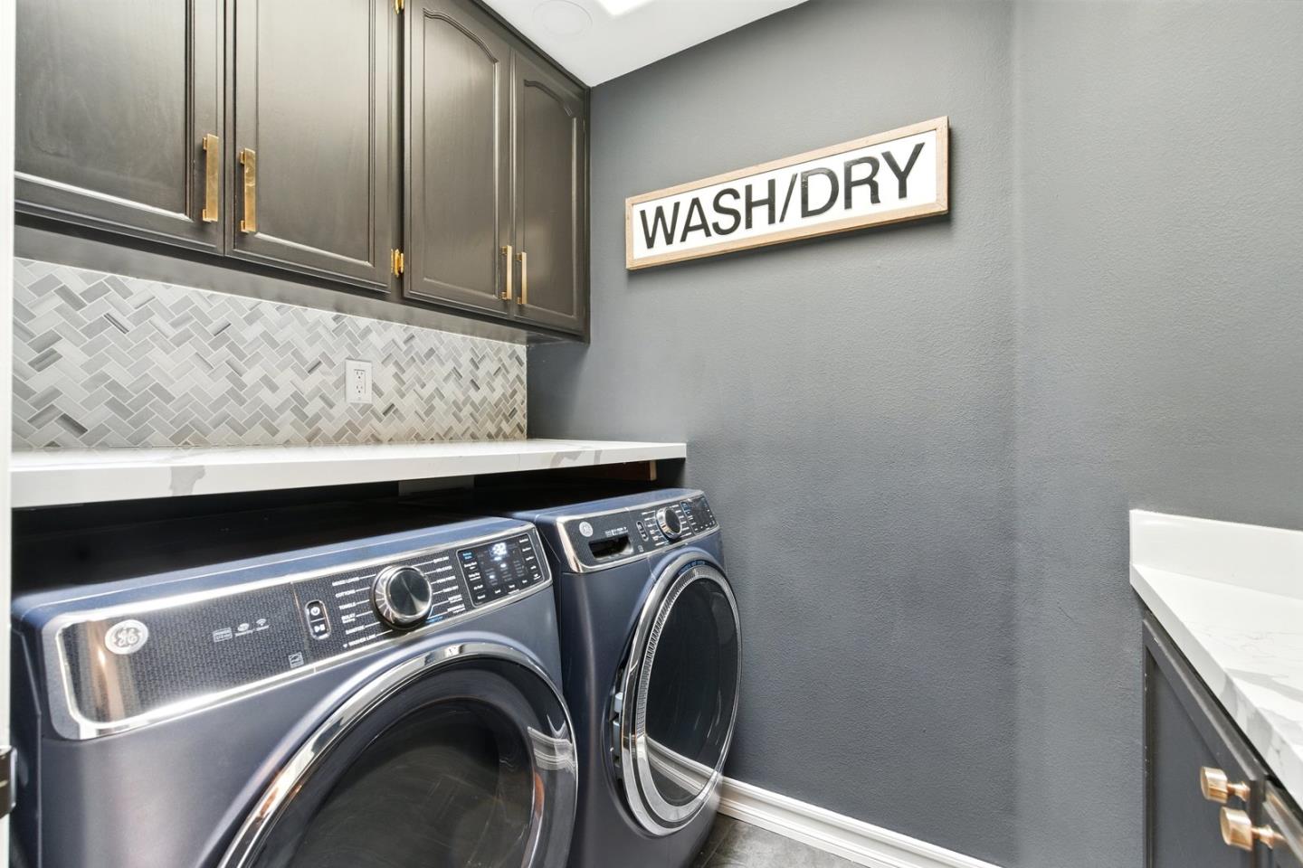 735 Georgetown Place Gilroy, CA 95020 - Photo 16 of 48 a view of storage and utility room with washer and dryer