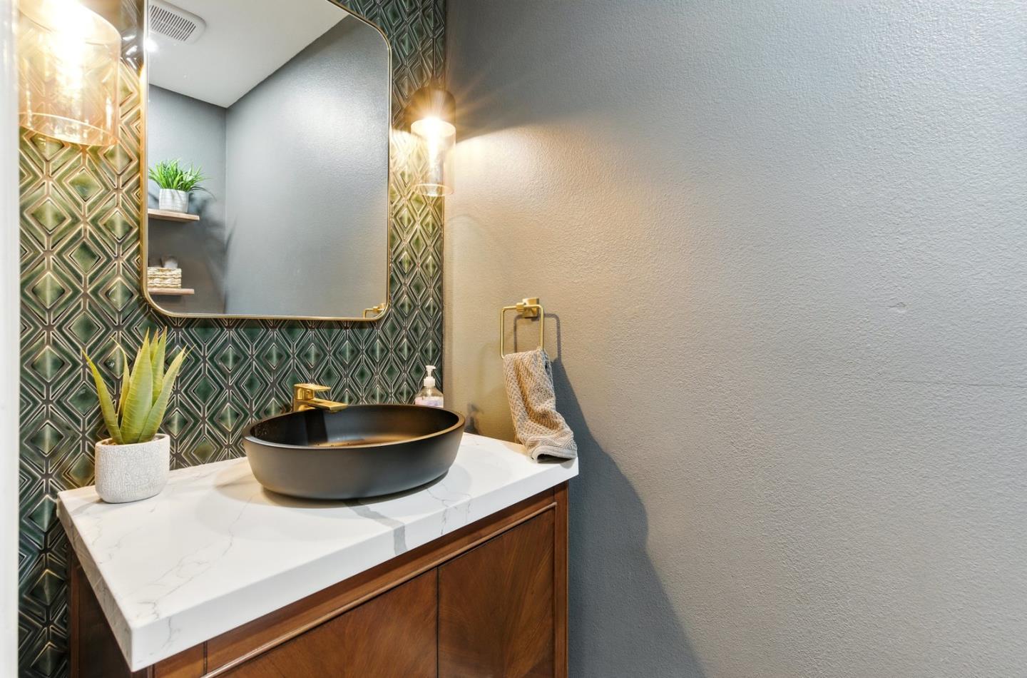 735 Georgetown Place Gilroy, CA 95020 - Photo 17 of 48 a bathroom with a sink and a mirror