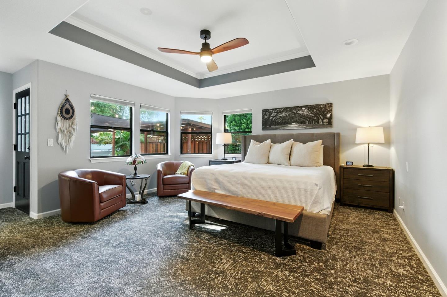 735 Georgetown Place Gilroy, CA 95020 - Photo 18 of 48 a spacious bedroom with a bed and a couch