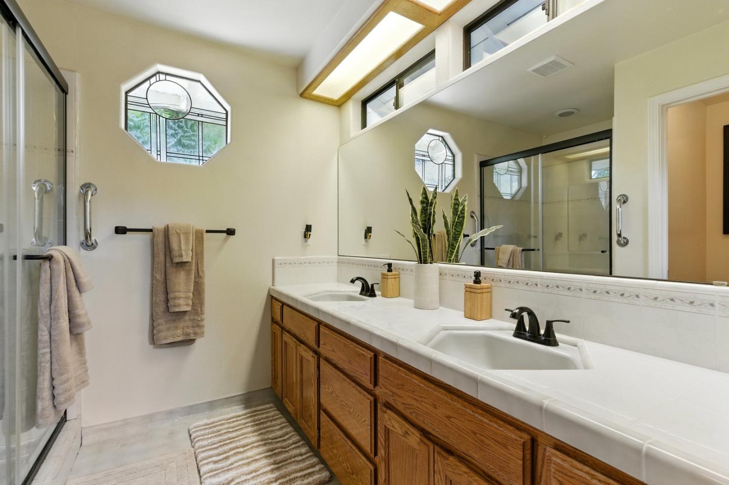 735 Georgetown Place Gilroy, CA 95020 - Photo 22 of 48 a bathroom with a sink and a mirror