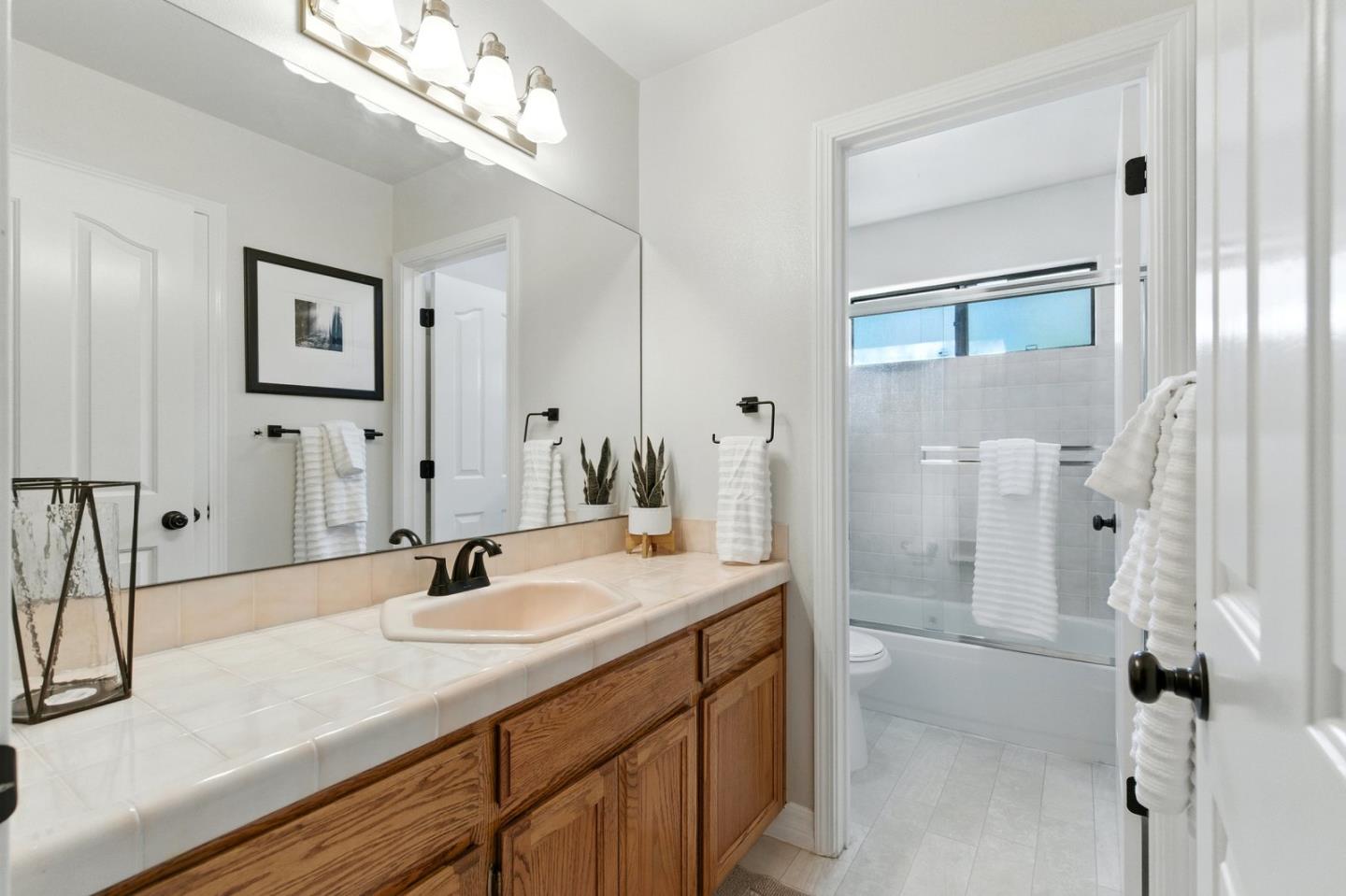 735 Georgetown Place Gilroy, CA 95020 - Photo 25 of 48 a bathroom with a sink double vanity and a mirror