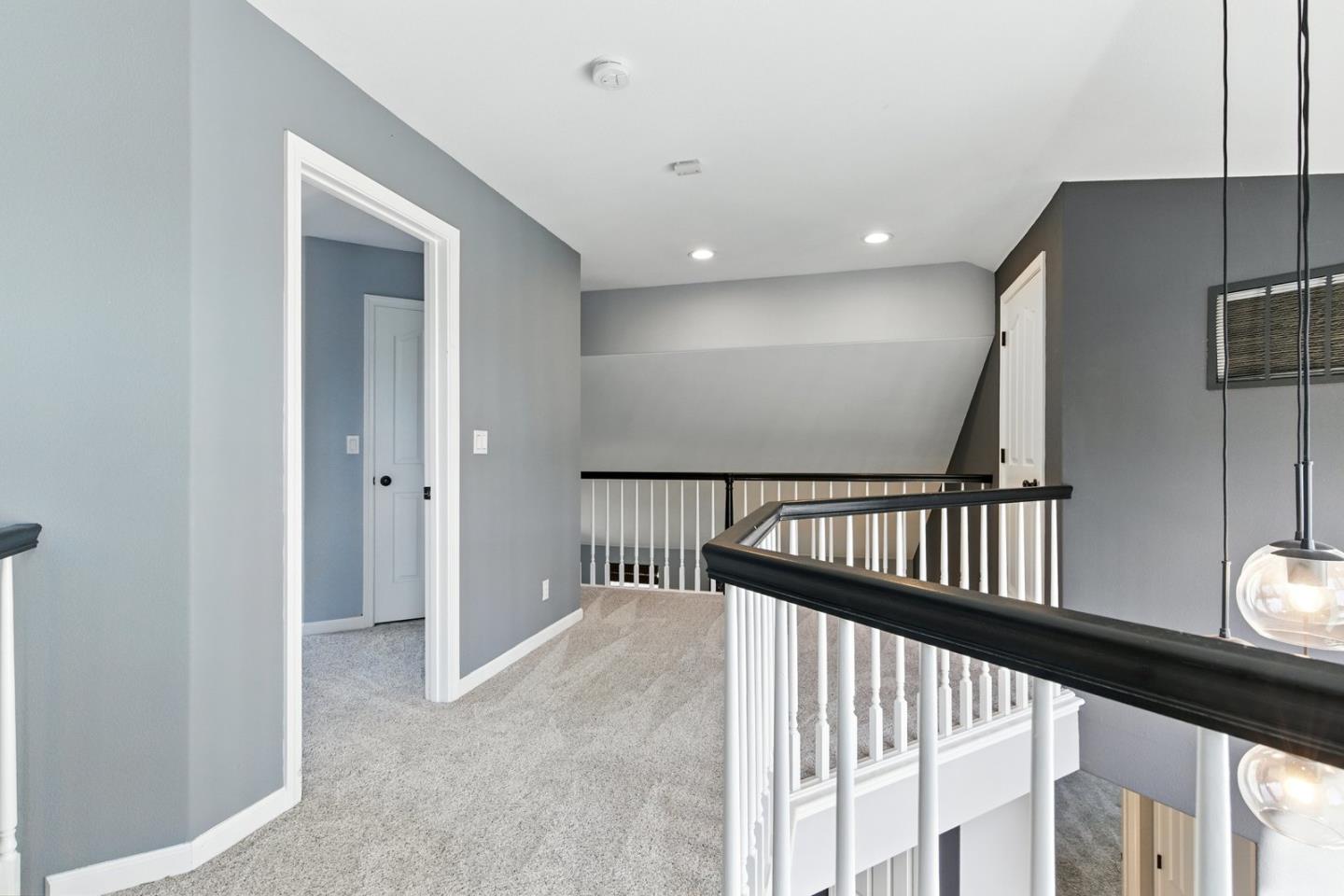 735 Georgetown Place Gilroy, CA 95020 - Photo 28 of 48 a view of staircase with railing and a chandelier