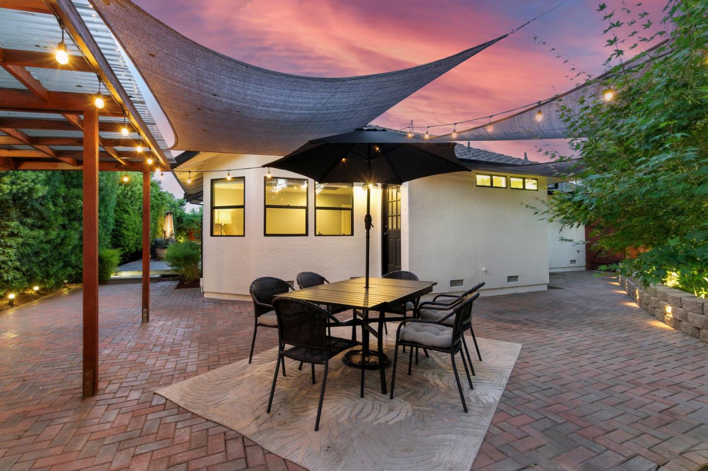 735 Georgetown Place Gilroy, CA 95020 - Photo 38 of 48 a view of a patio with table and chairs and potted plants