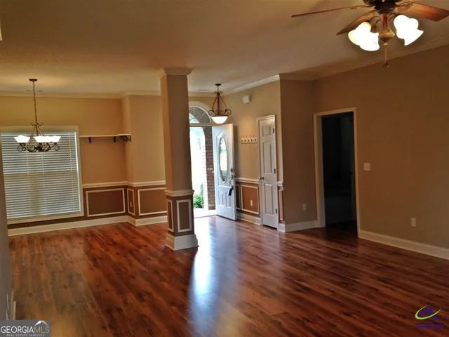 a view of a livingroom with wooden floor