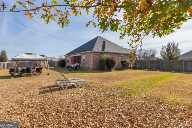 a house with trees in the background