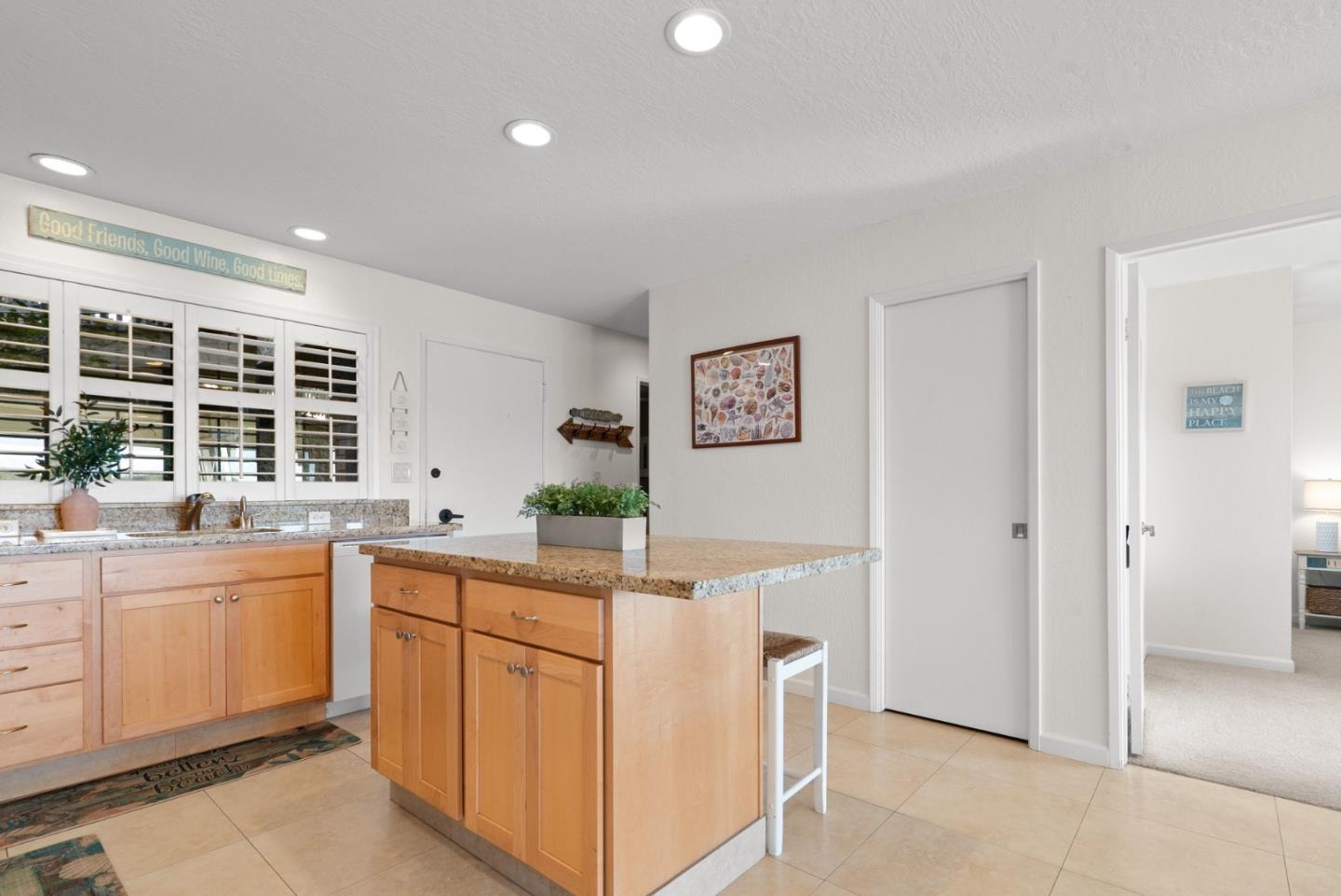 101 Shell Road, Unit 208 Watsonville, CA 95076 - Photo 13 of 26 a kitchen that has a sink and a stove in it