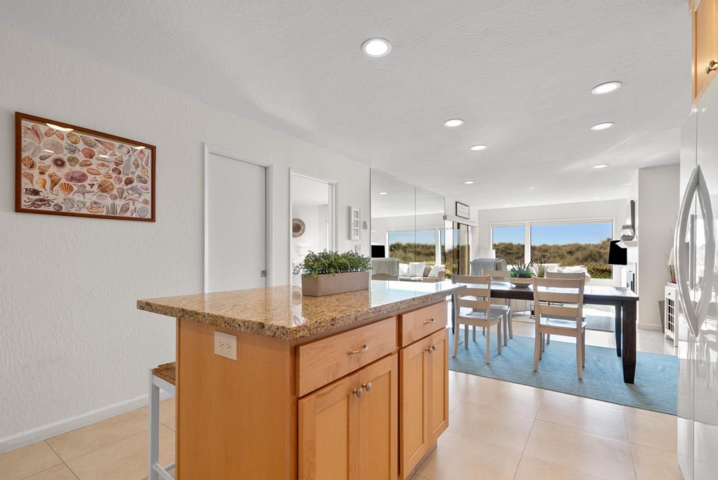 101 Shell Road, Unit 208 Watsonville, CA 95076 - Photo 14 of 26 a kitchen with a table and chairs