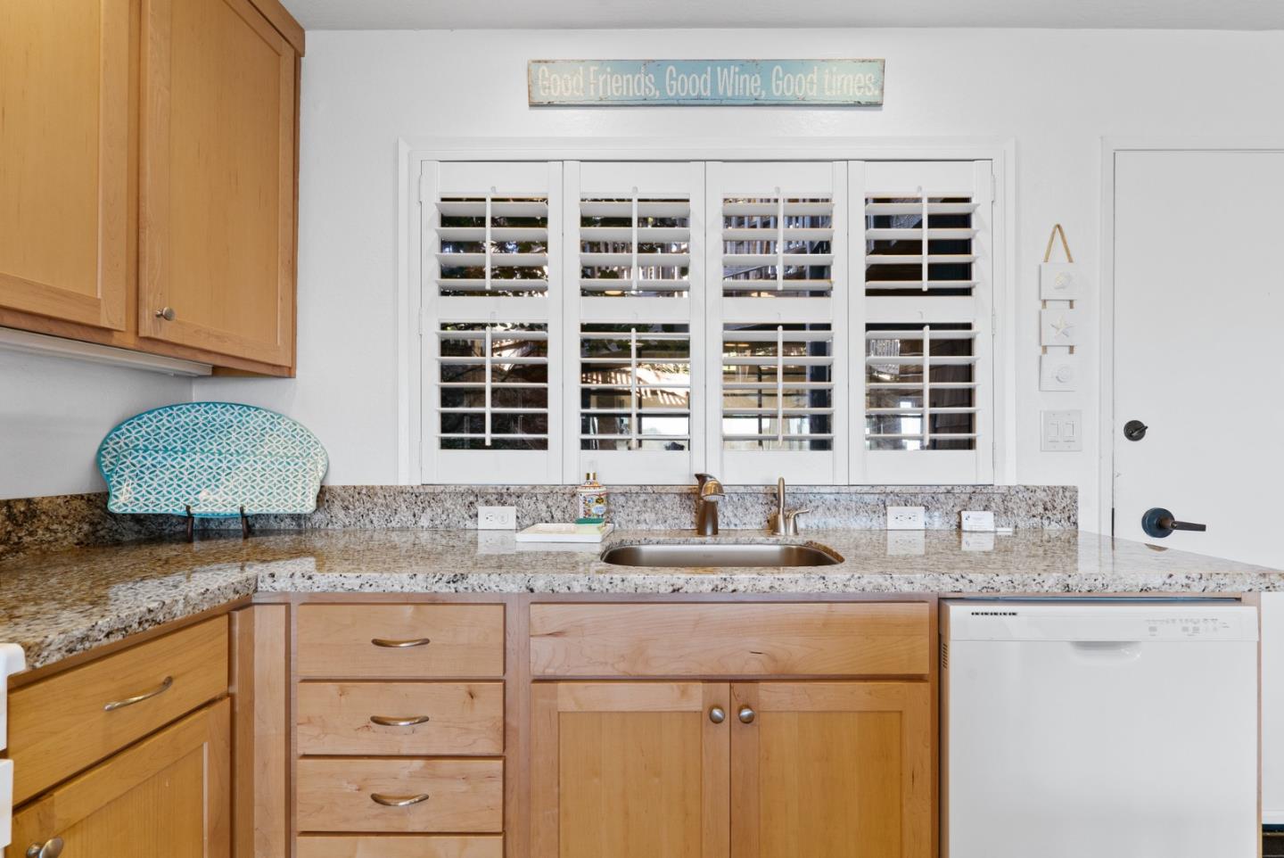101 Shell Road, Unit 208 Watsonville, CA 95076 - Photo 16 of 30 a kitchen with granite countertop a sink and cabinets