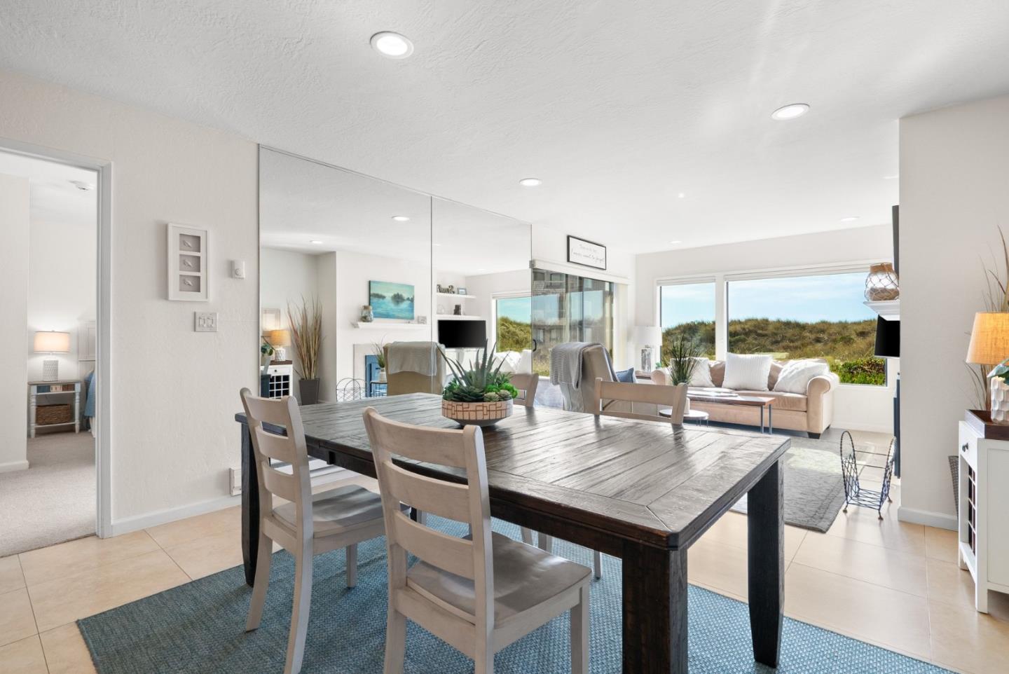 101 Shell Road, Unit 208 Watsonville, CA 95076 - Photo 16 of 26 a view of a dining room with furniture and wooden floor