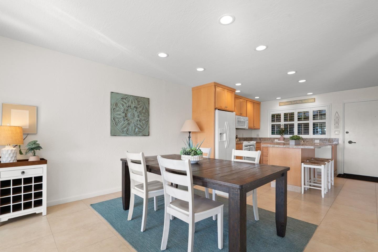 101 Shell Road, Unit 208 Watsonville, CA 95076 - Photo 18 of 26 a dining room with furniture a window and wooden floor