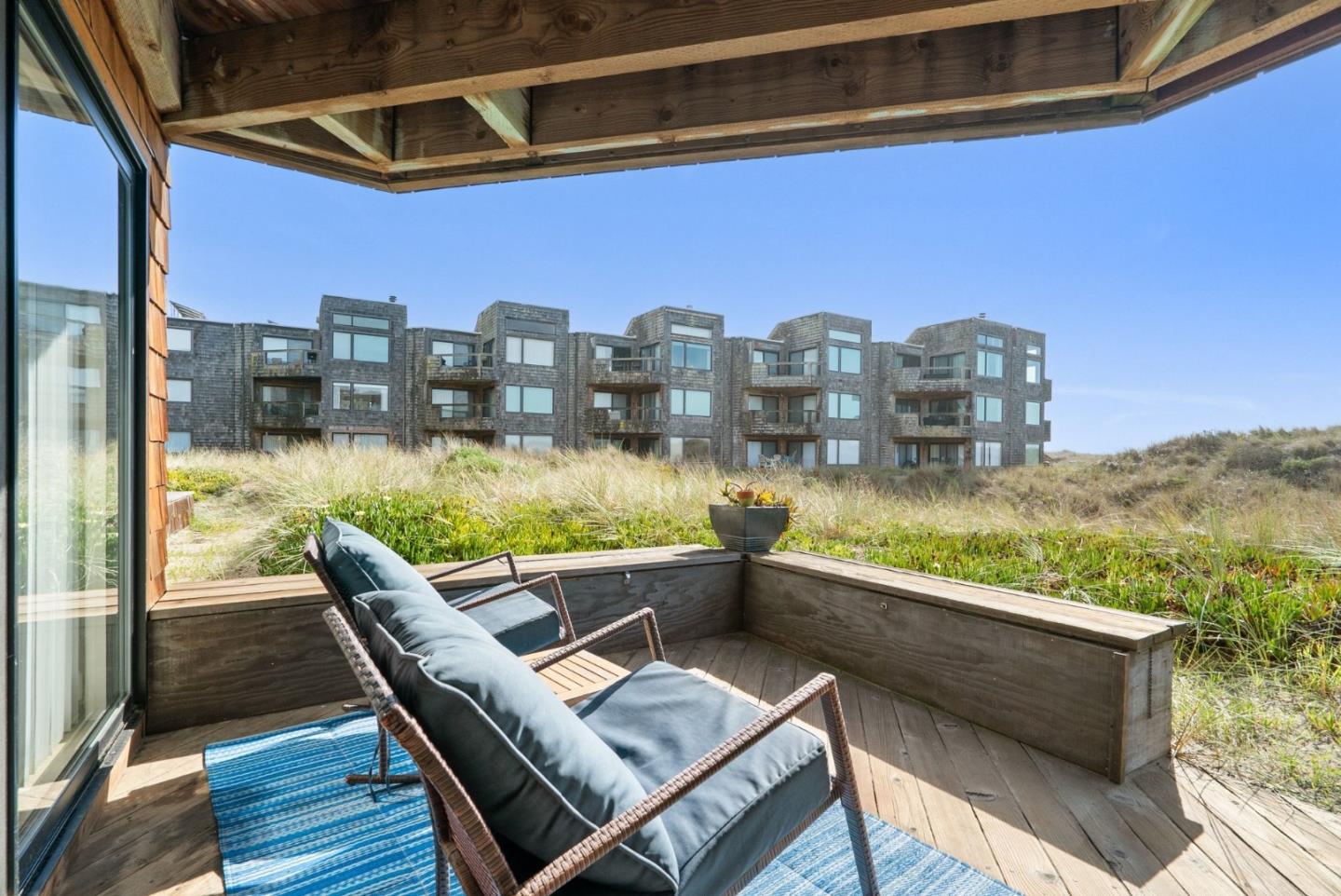 101 Shell Road, Unit 208 Watsonville, CA 95076 - Photo 19 of 26 a view of roof deck with chairs and wooden fence