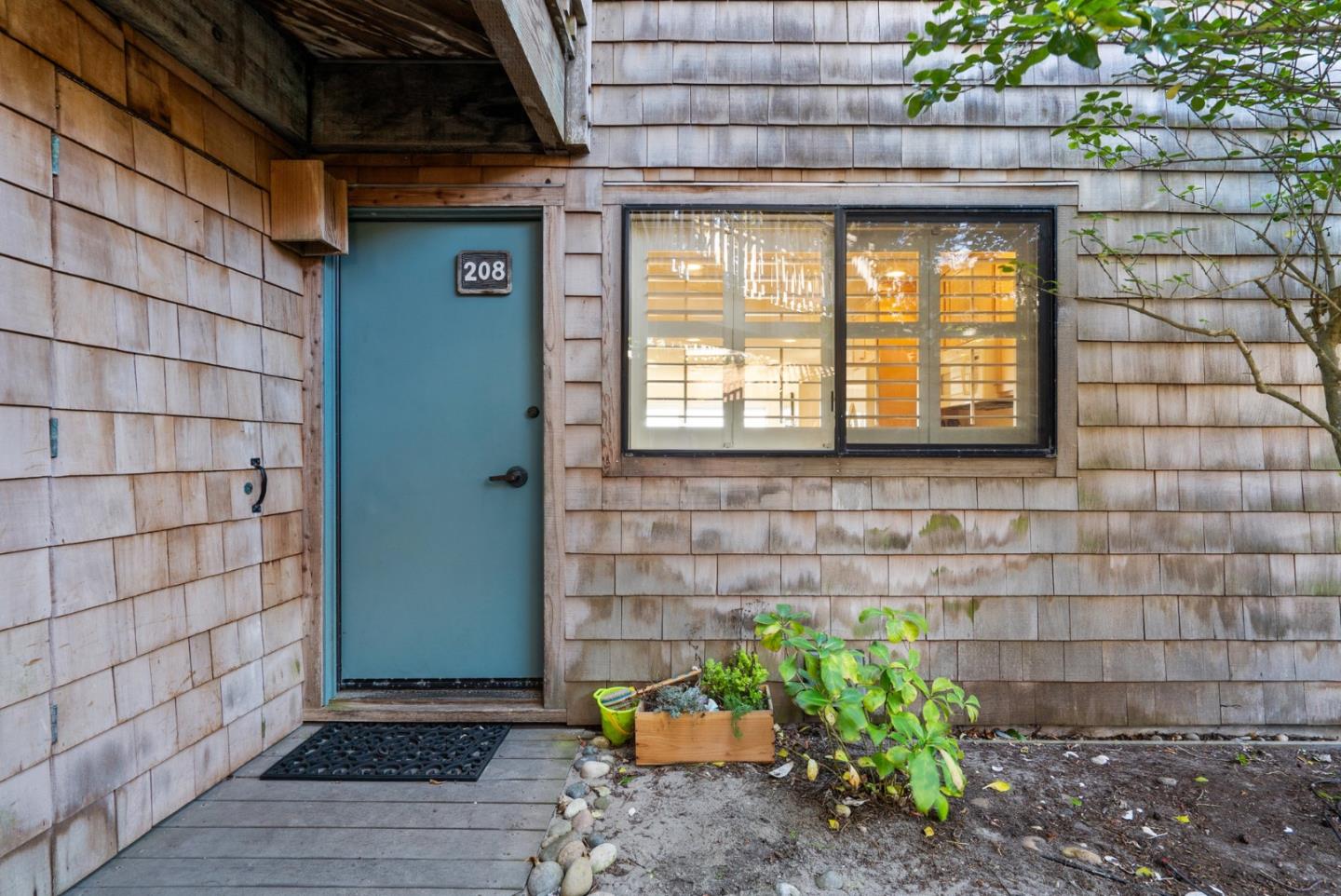 101 Shell Road, Unit 208 Watsonville, CA 95076 - Photo 2 of 30 a front view of a house with a yard