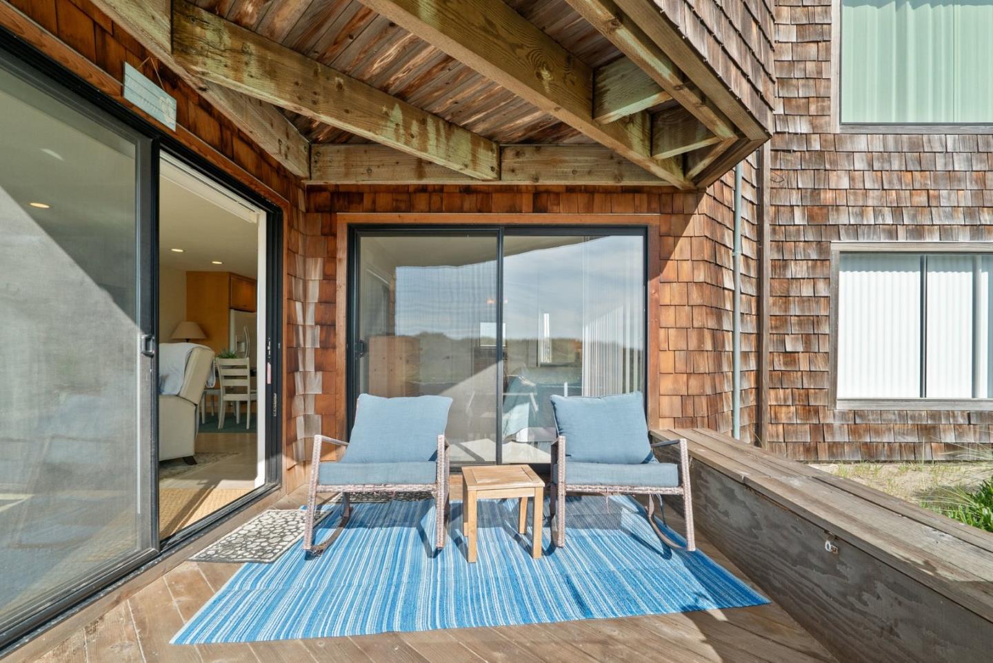 101 Shell Road, Unit 208 Watsonville, CA 95076 - Photo 21 of 26 a sitting area with wooden floor and balcony