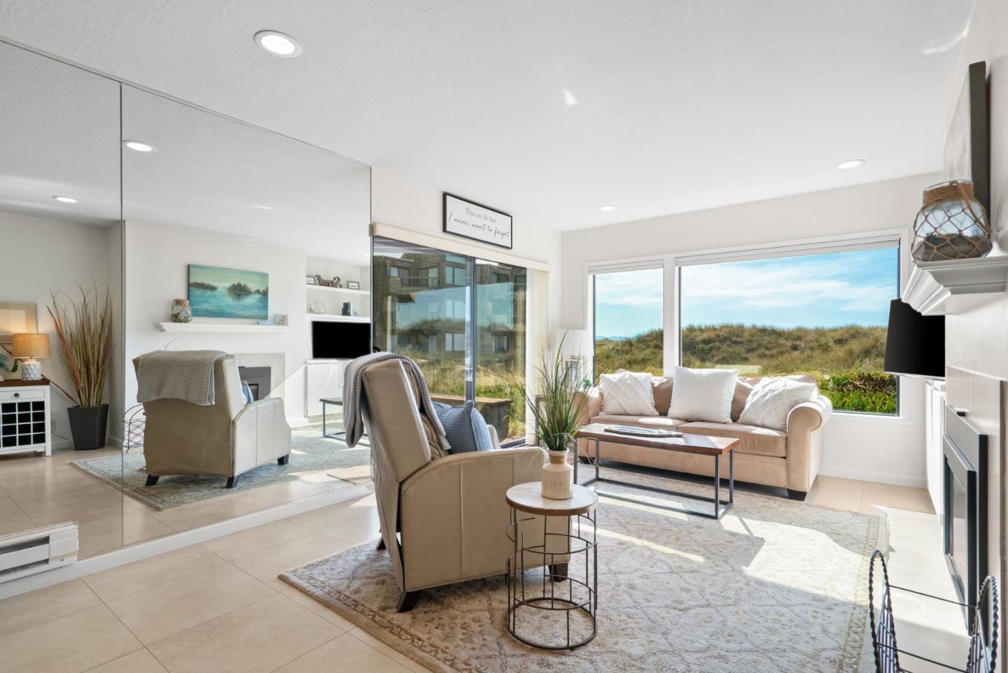 101 Shell Road, Unit 208 Watsonville, CA 95076 - Photo 4 of 26 a living room with furniture fireplace and a large window