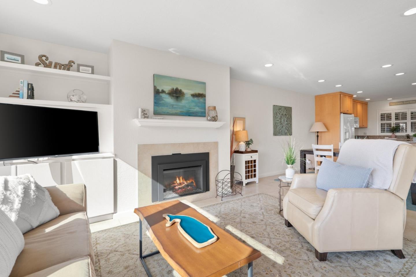 101 Shell Road, Unit 208 Watsonville, CA 95076 - Photo 6 of 26 a living room with furniture and a fireplace