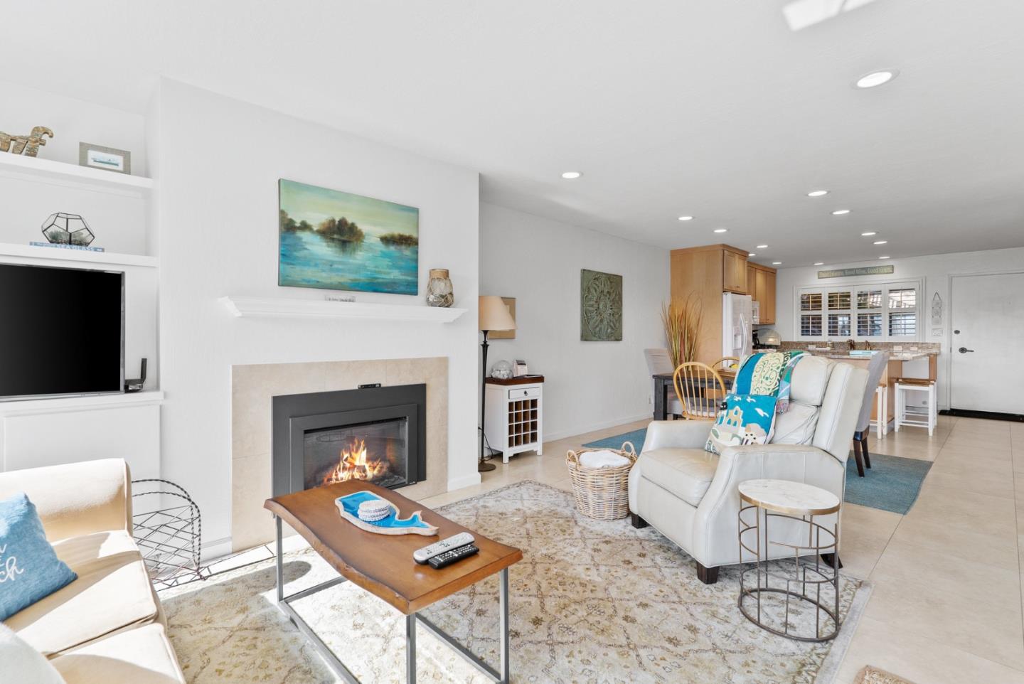 101 Shell Road, Unit 208 Watsonville, CA 95076 - Photo 8 of 30 a living room with furniture a fireplace and a flat screen tv