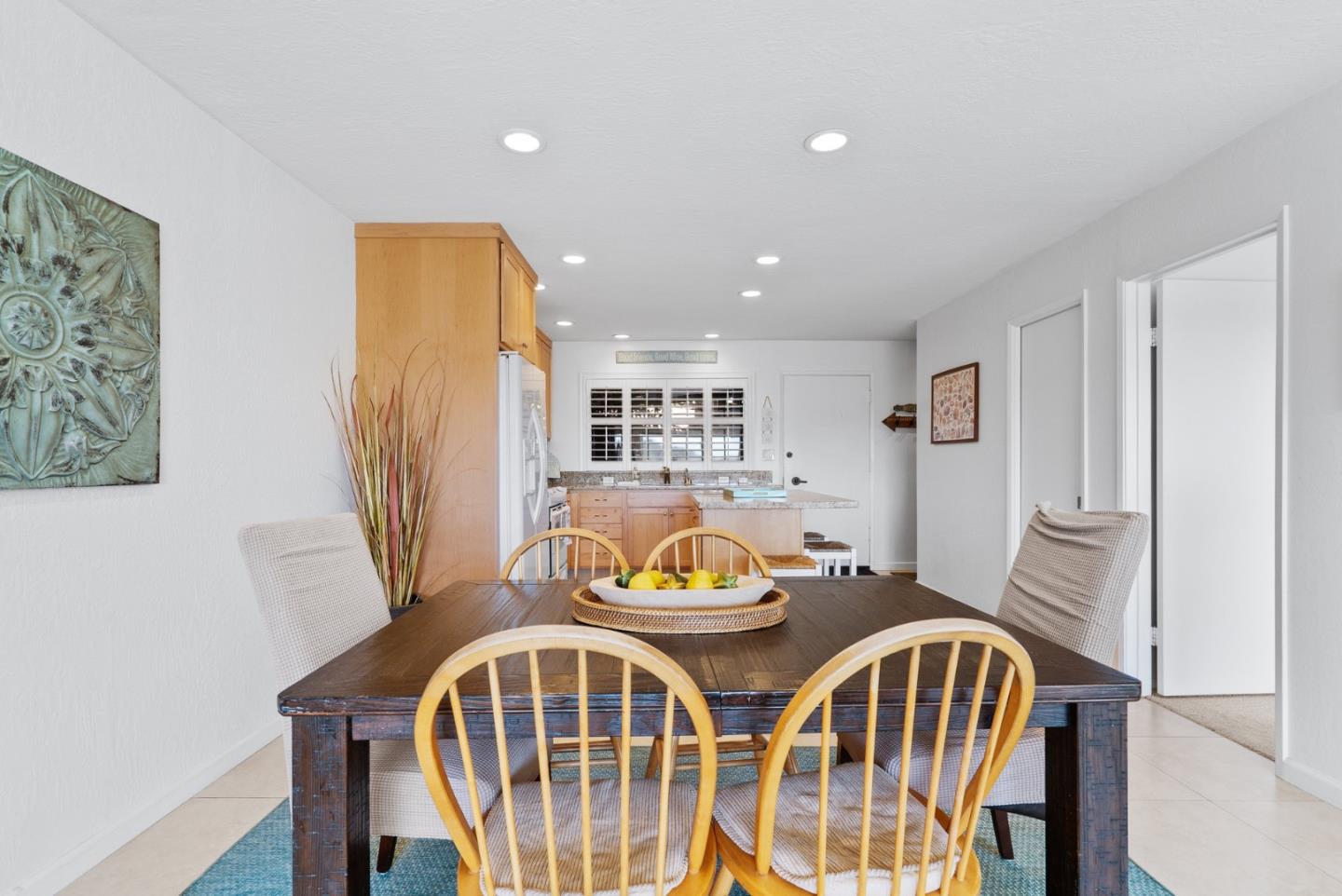 101 Shell Road, Unit 208 Watsonville, CA 95076 - Photo 10 of 30 a view of a dining room with furniture and wooden floor