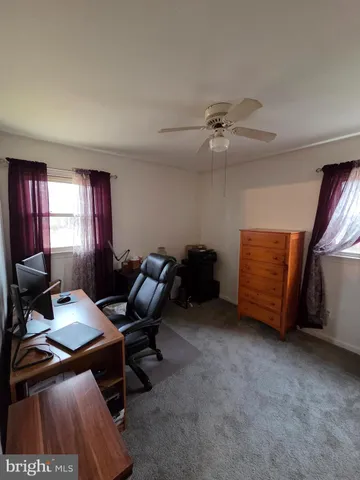 a view of front door and bedroom