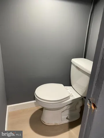 a white toilet sitting next to a white toilet