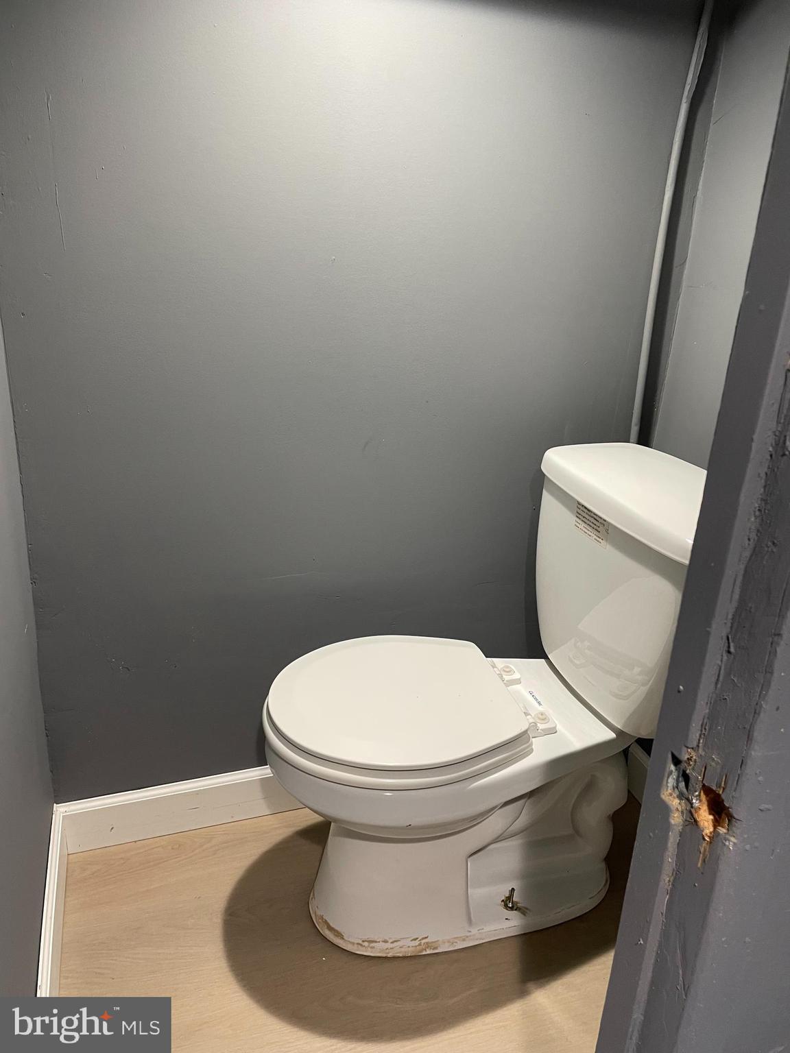 3211 Chesterfield Avenue Baltimore, MD 21213 - Photo 20 of 26 a white toilet sitting next to a white toilet
