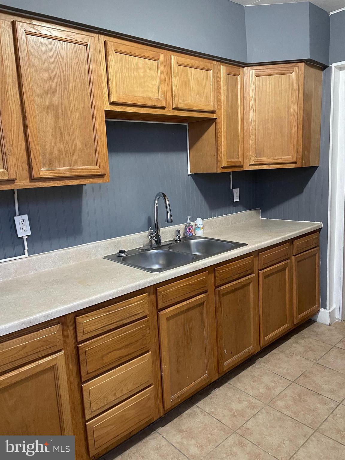 3211 Chesterfield Avenue Baltimore, MD 21213 - Photo 6 of 26 a kitchen with a sink and cabinets