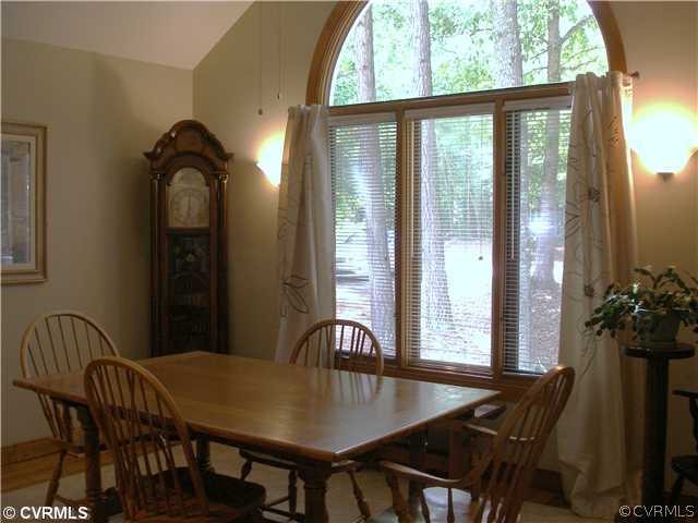 14206 Spring Gate Road Midlothian, VA 23112 - Photo 4 of 10 a view of a dining room with furniture and window