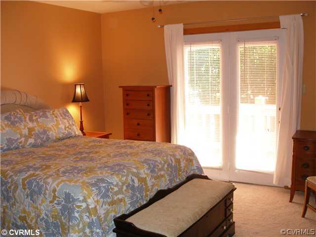 14206 Spring Gate Road Midlothian, VA 23112 - Photo 5 of 10 a bedroom with a bed and a window