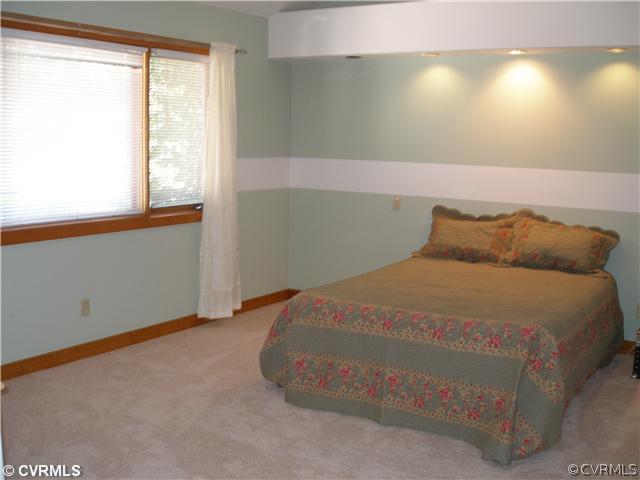 14206 Spring Gate Road Midlothian, VA 23112 - Photo 6 of 10 a bedroom with a bed and window