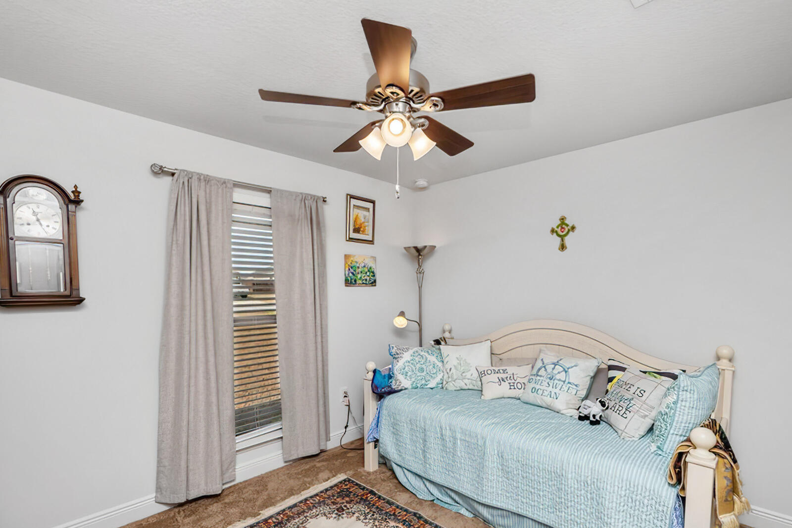 5739 Marigold Loop Crestview, FL 32539 - Photo 17 of 36 a bedroom with a bed and a chandelier