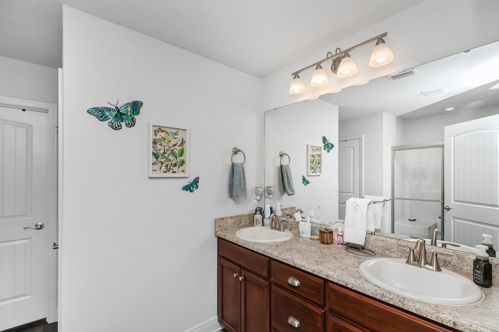 5739 Marigold Loop Crestview, FL 32539 - Photo 32 of 36 a bathroom with a granite countertop sink a light fixture and a mirror