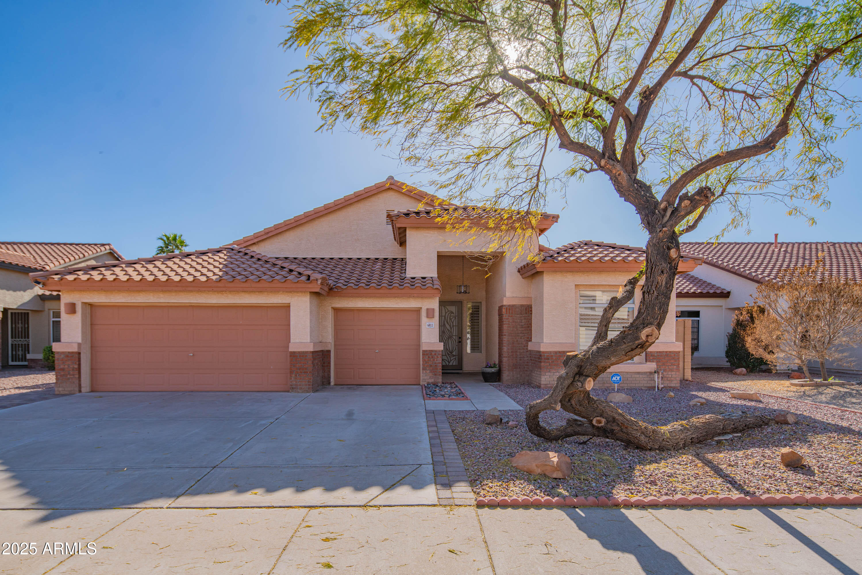 6811 West Del Rio Street, Unit 2 Chandler, AZ 85226 - Photo 1 of 49 a front view of a house with a tree