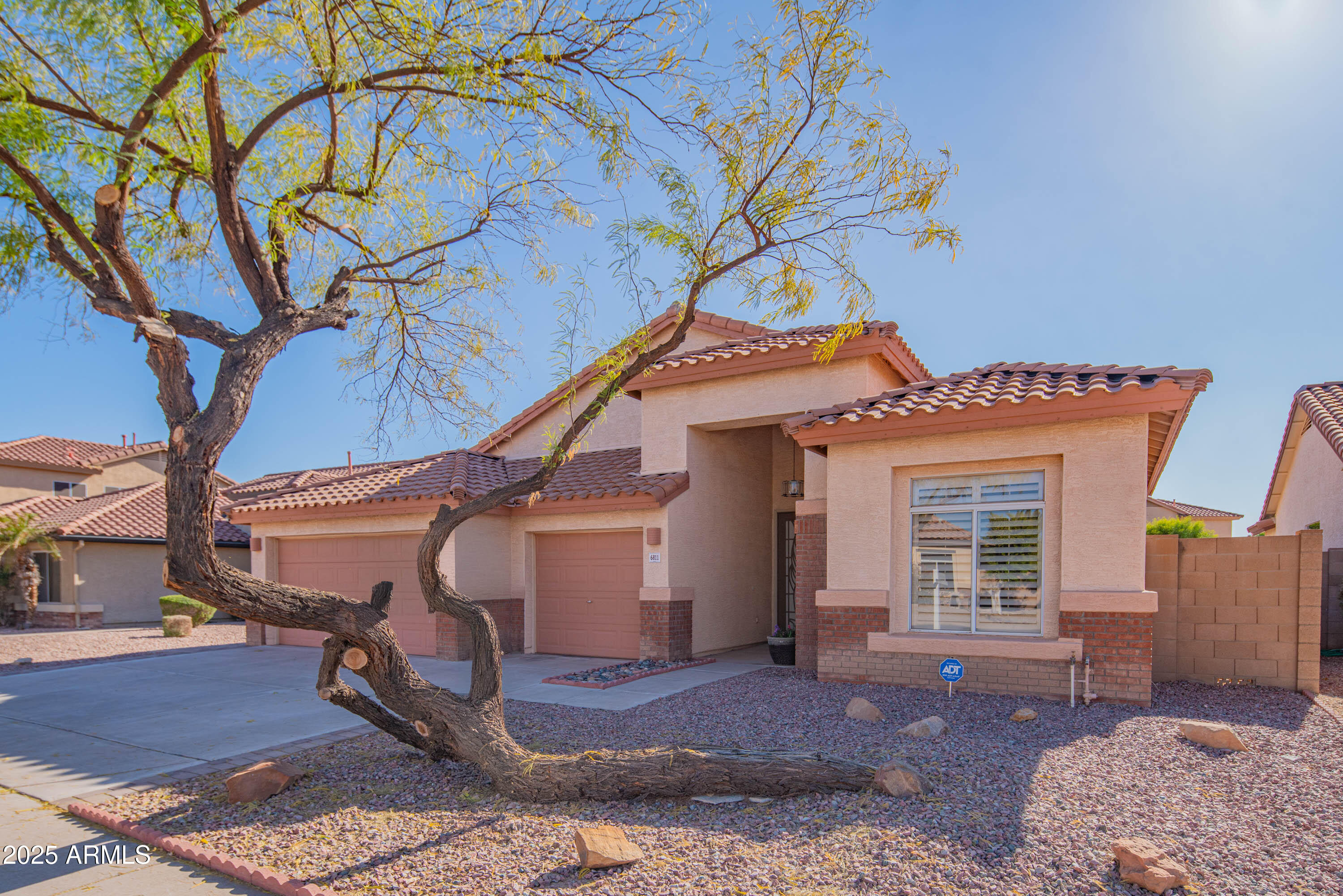 6811 West Del Rio Street, Unit 2 Chandler, AZ 85226 - Photo 2 of 49 a front view of a house with a yard