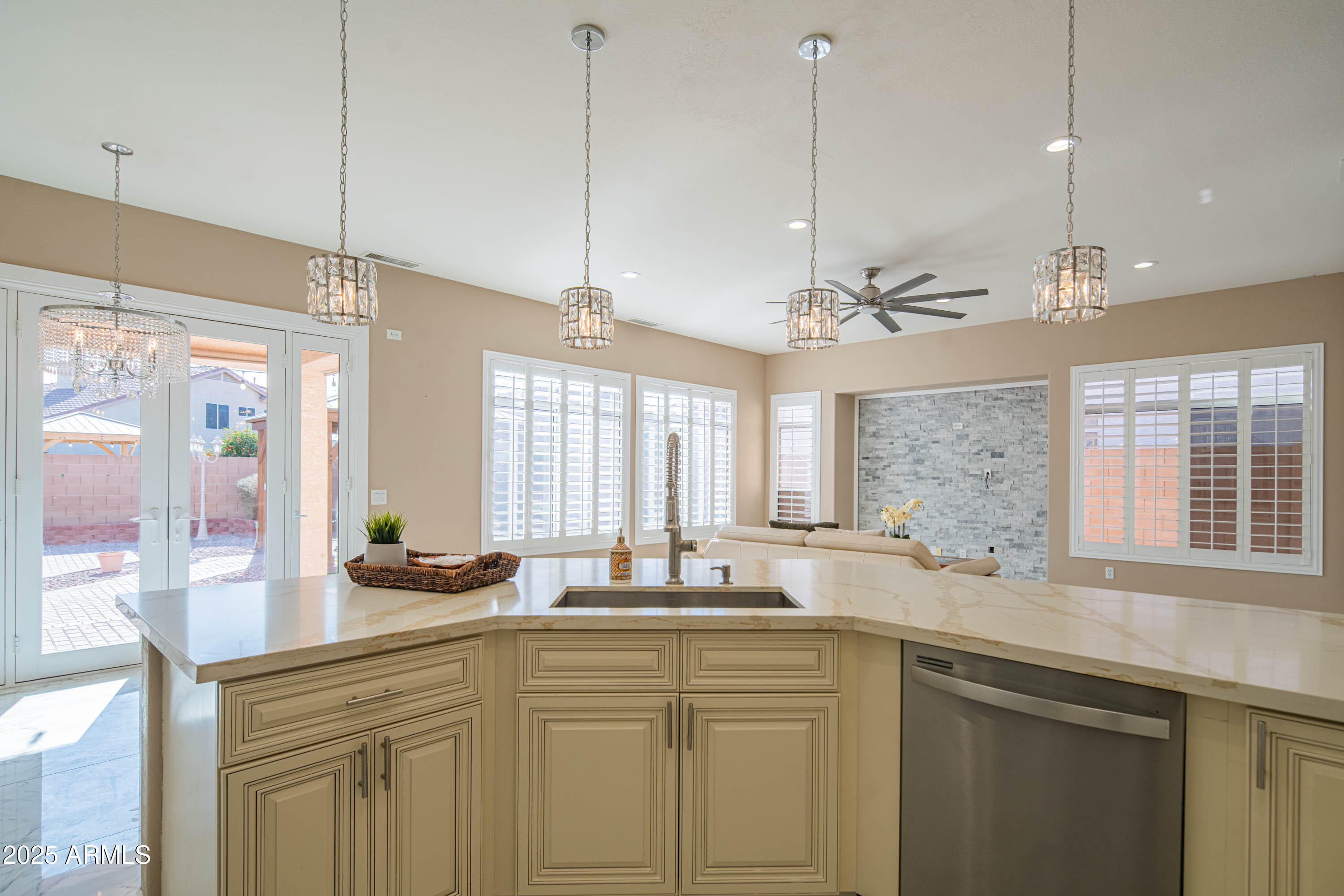 6811 West Del Rio Street, Unit 2 Chandler, AZ 85226 - Photo 21 of 49 a kitchen with counter top windows and a chandelier