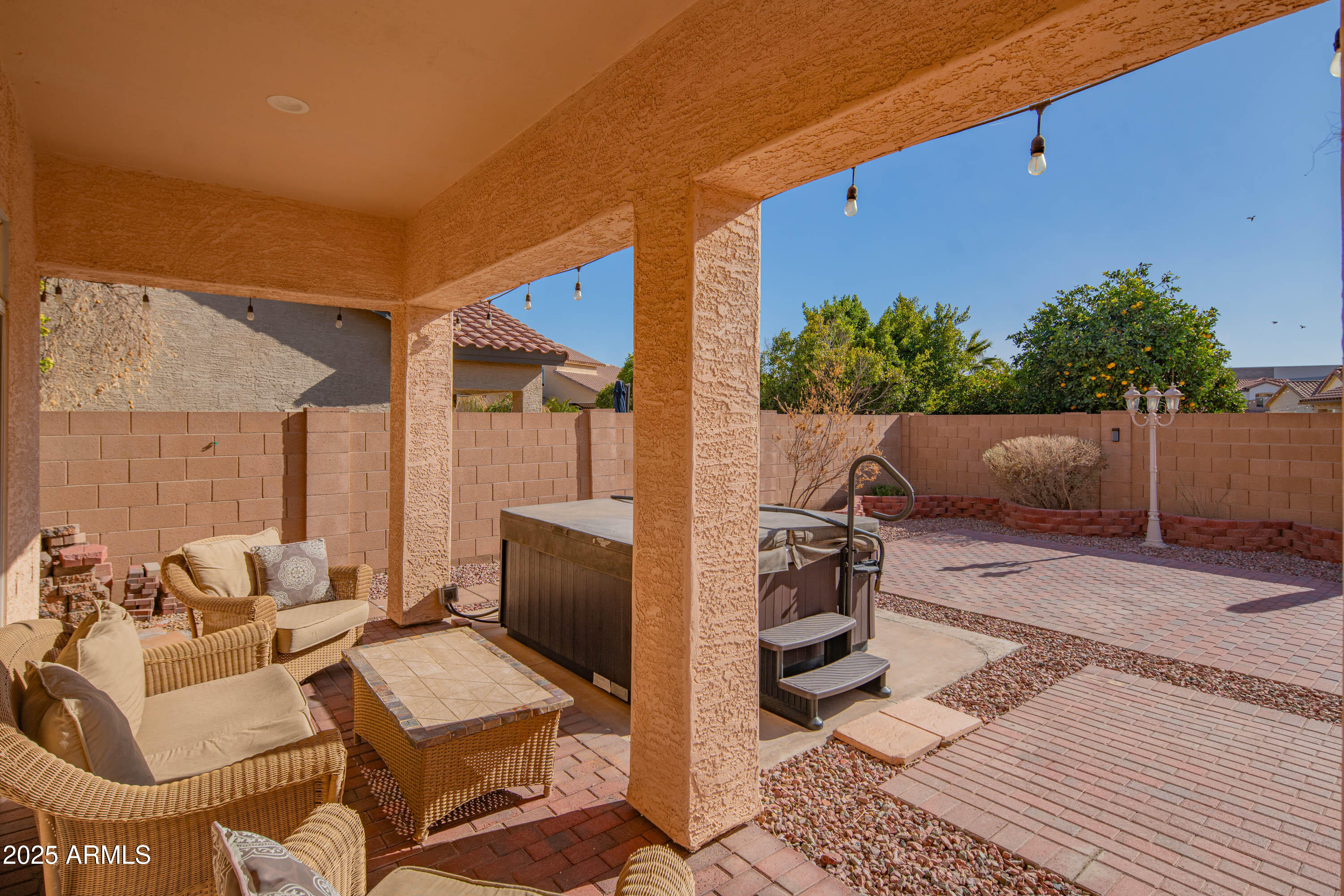 6811 West Del Rio Street, Unit 2 Chandler, AZ 85226 - Photo 38 of 49 a view of a patio with couches and table and chairs and potted plants