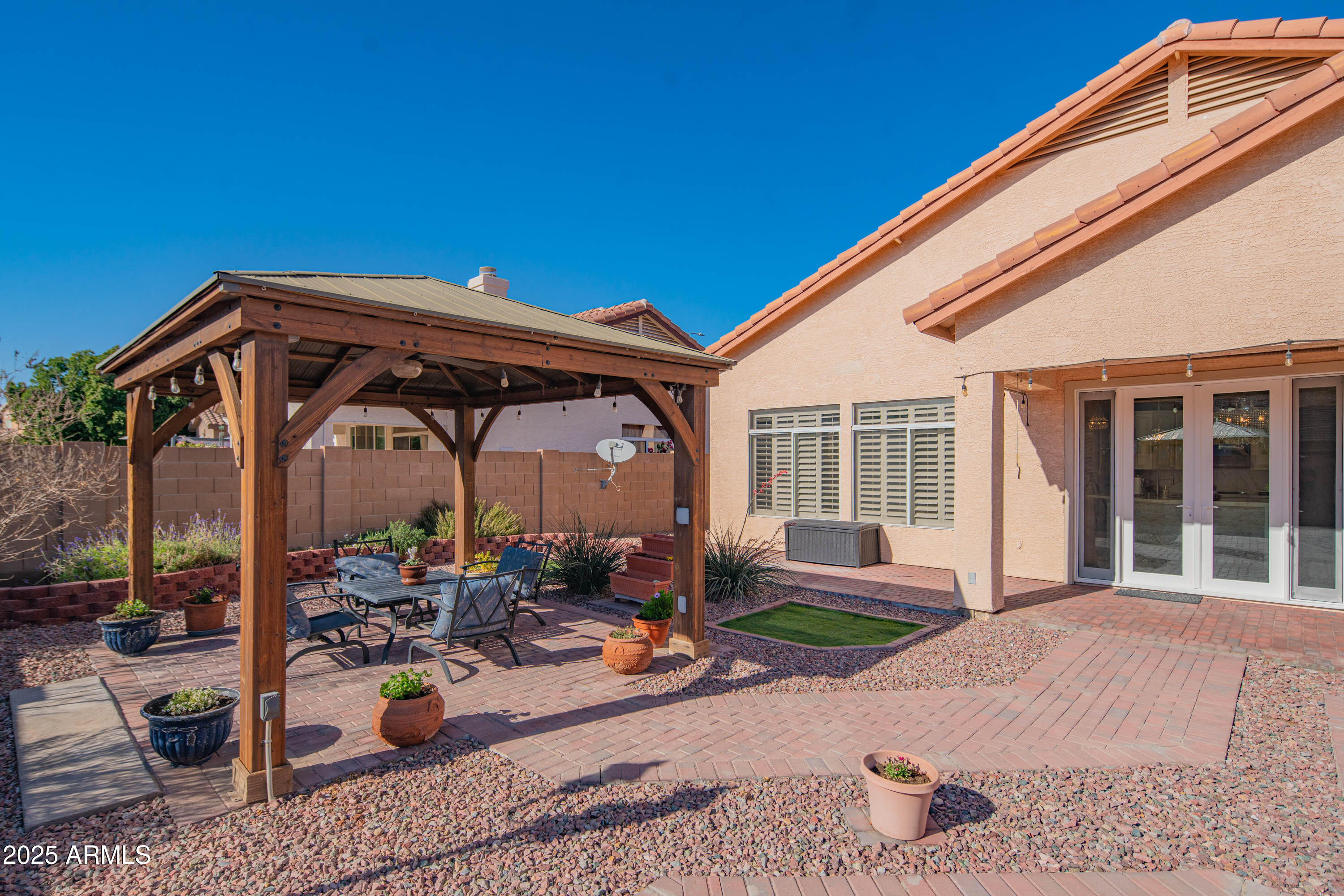6811 West Del Rio Street, Unit 2 Chandler, AZ 85226 - Photo 43 of 49 a view of a chair and tables in the patio