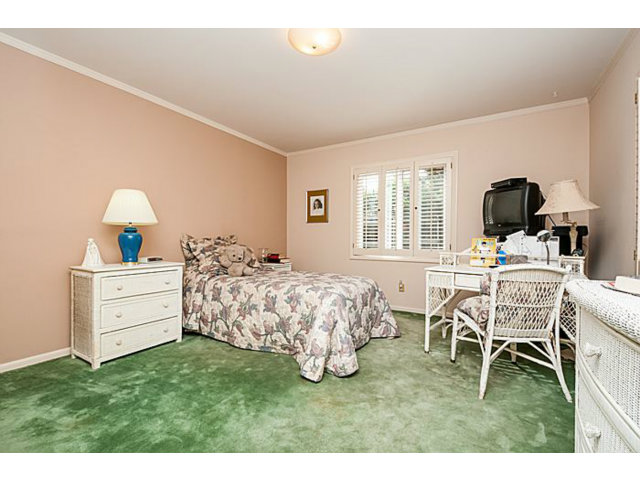 39 De Sabla Road San Mateo, CA 94402 - Photo 19 of 25 a bed room with a bed and a chair