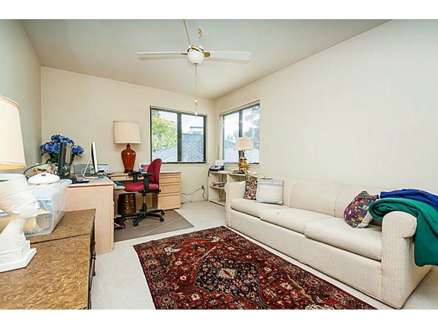 39 De Sabla Road San Mateo, CA 94402 - Photo 22 of 25 a living room with furniture and a chandelier