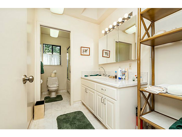 39 De Sabla Road San Mateo, CA 94402 - Photo 23 of 25 a bathroom with a sink toilet and a mirror