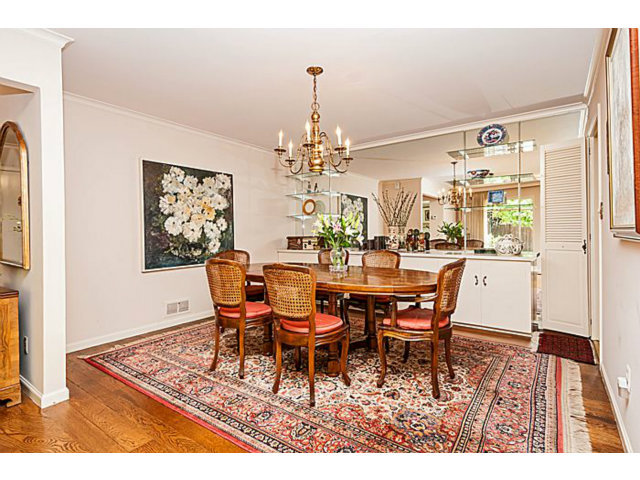 39 De Sabla Road San Mateo, CA 94402 - Photo 7 of 25 a dining room with furniture a rug and a chandelier