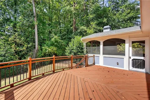a view of balcony with deck and wooden floor
