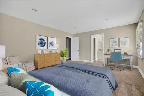 a bedroom with a bed and furniture