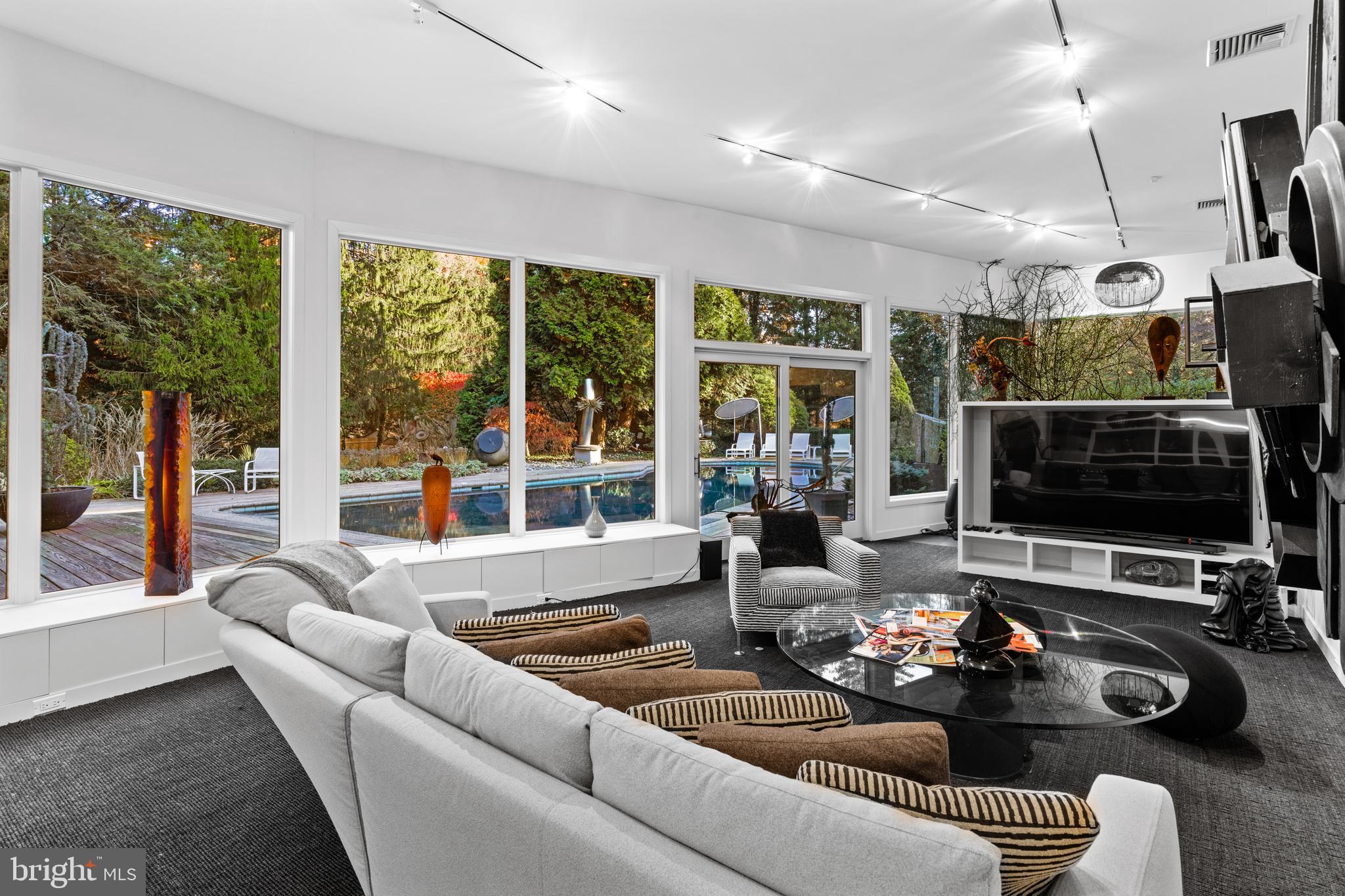 1041 Waverly Road Gladwyne, PA 19035 - Photo 15 of 39 a living room with furniture and a flat screen tv