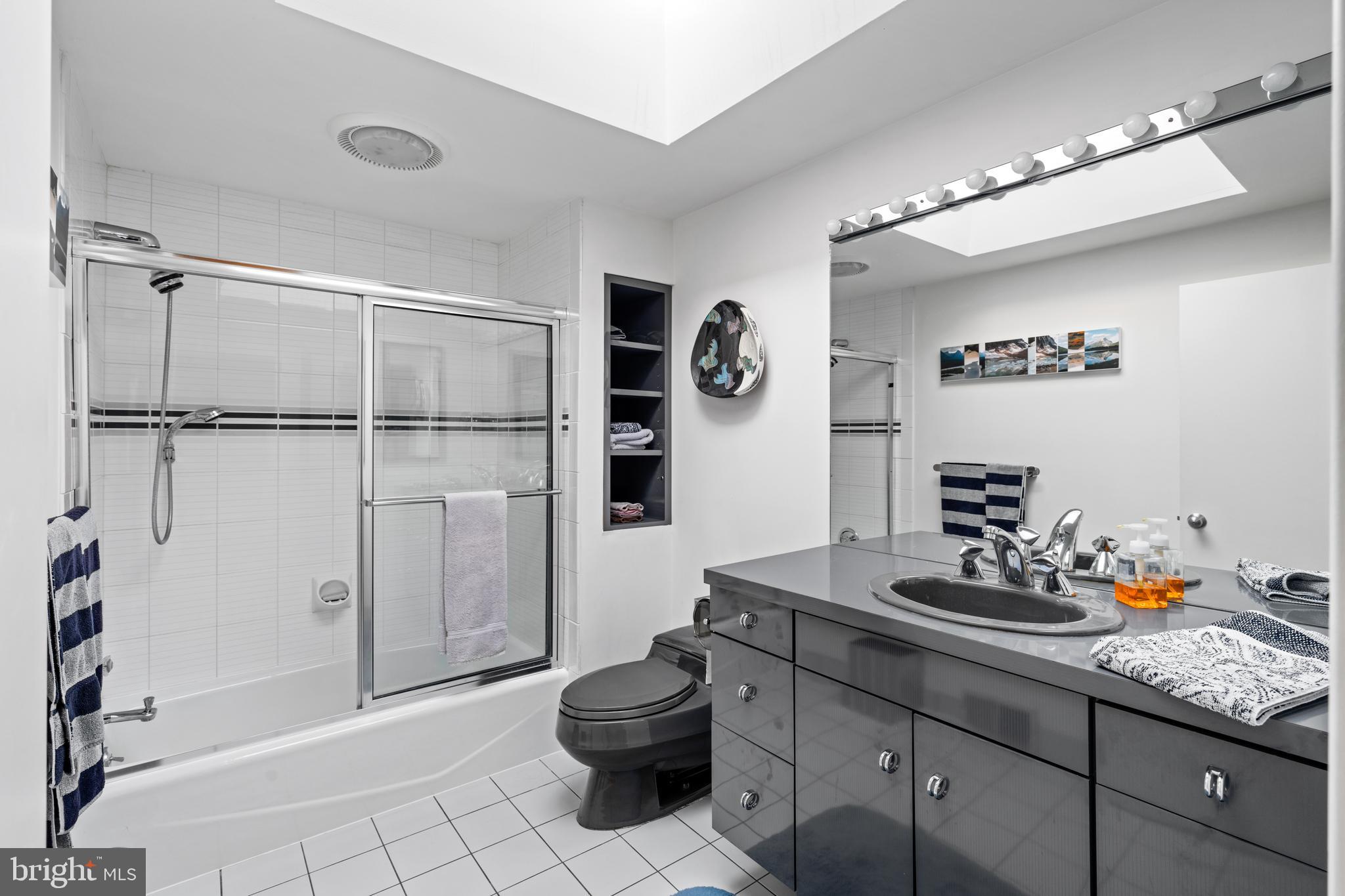 1041 Waverly Road Gladwyne, PA 19035 - Photo 30 of 39 a bathroom with a sink and a mirror