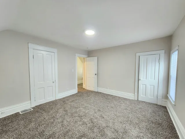 a view of an empty room and window