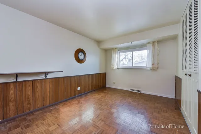 a view of an empty room with windows