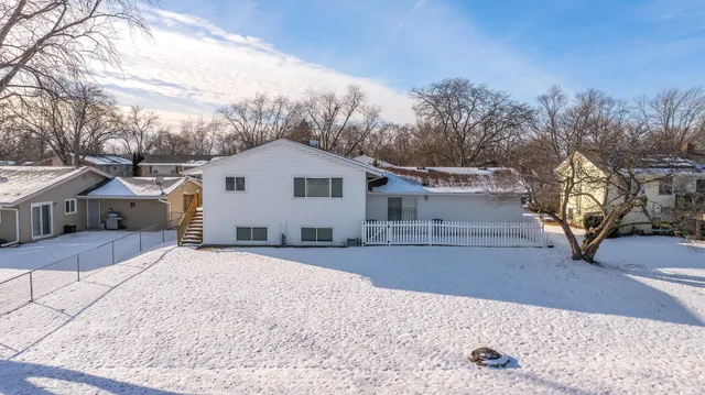 an aerial view of a house with outdoor space