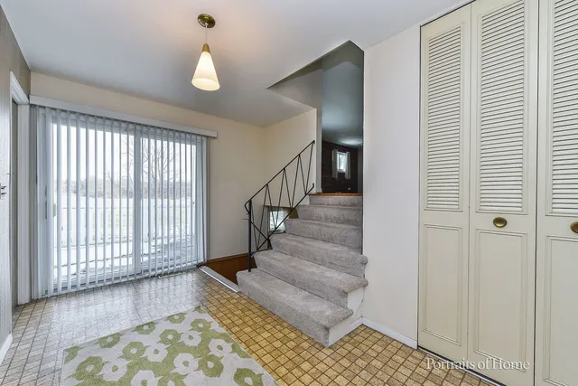 a view of entryway with wooden floor