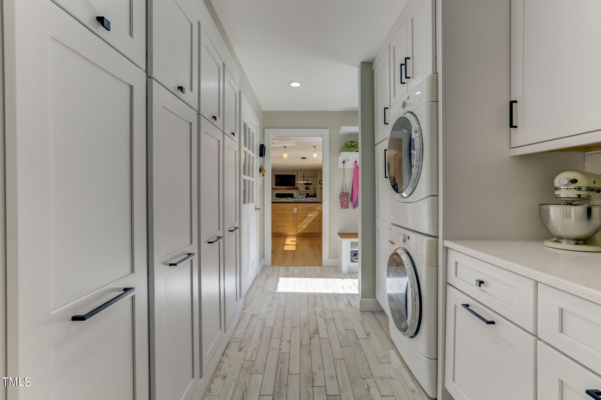 11601 Rutledge Bay Road Raleigh, NC 27614 - Photo 16 of 59 a view of a hallway with washer and dryer